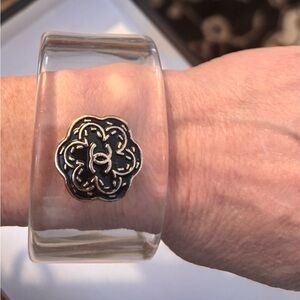 Clear acrylic bracelet with button detail